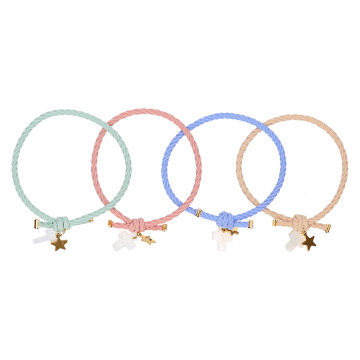 Elastic girl bracelets with cross and golden star.
