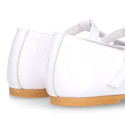 Little Girl T-Strap OKAA Mary Jane shoes in white patent leather.