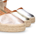 Woman wedge espadrilles shoes with Tulip shape in laminated leather.