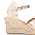 Woman wedge espadrilles shoes with Tulip shape in laminated leather.