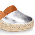 Woman wedge espadrilles shoes with Tulip shape in laminated leather.