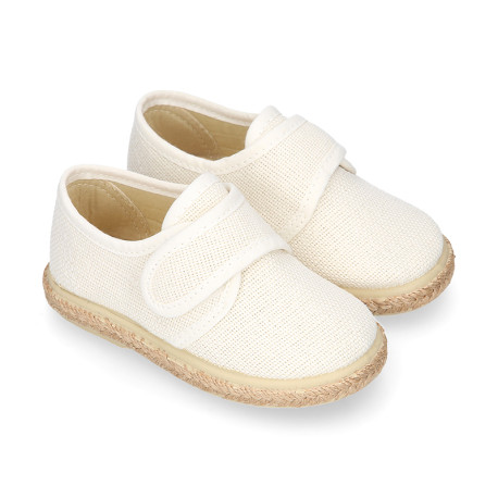 White linen canvas oxford shoe espadrille style with hook and loop closure.