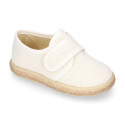White linen canvas oxford shoe espadrille style with hook and loop closure.