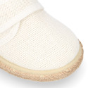 White linen canvas oxford shoe espadrille style with hook and loop closure.
