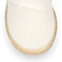 White linen canvas oxford shoe espadrille style with hook and loop closure.