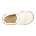 White linen canvas oxford shoe espadrille style with hook and loop closure.