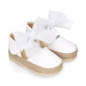 White cotton canvas baby girl espadrille shoes with tulle bow design.