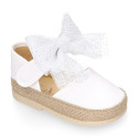 White cotton canvas baby girl espadrille shoes with tulle bow design.