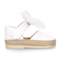 White cotton canvas baby girl espadrille shoes with tulle bow design.