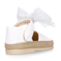 White cotton canvas baby girl espadrille shoes with tulle bow design.