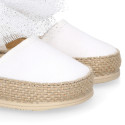 White cotton canvas baby girl espadrille shoes with tulle bow design.