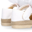 White cotton canvas baby girl espadrille shoes with tulle bow design.