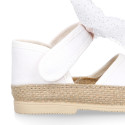 White cotton canvas baby girl espadrille shoes with tulle bow design.