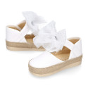 White cotton canvas baby girl espadrille shoes with tulle bow design.