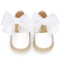 White cotton canvas baby girl espadrille shoes with tulle bow design.