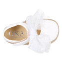 White cotton canvas baby girl espadrille shoes with tulle bow design.