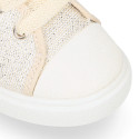 Cotton Canvas OKAA Girl Sneaker laceless and with toe cap design.