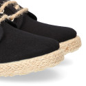 Kids laces up shoes espadrille style in black cotton canvas to dress.