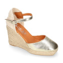 Woman wedge espadrilles shoes with square toe cap in laminated leather.