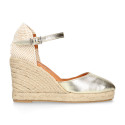 Woman wedge espadrilles shoes with square toe cap in laminated leather.