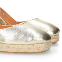 Woman wedge espadrilles shoes with square toe cap in laminated leather.