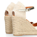 Woman wedge espadrilles shoes with square toe cap in laminated leather.