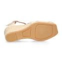 Woman wedge espadrilles shoes with square toe cap in laminated leather.