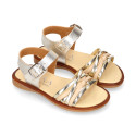 Laminated leather girl sandal shoes with braided design in gold color.