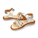 Laminated leather girl sandal shoes with braided design in gold color.