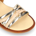 Laminated leather girl sandal shoes with braided design in gold color.