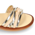 Laminated leather girl sandal shoes with braided design in gold color.