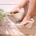 Woman wedge espadrilles shoes with square toe cap in laminated leather.