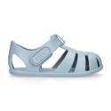 Children's barefoot jelly shoes with adhesive closure for the beach and pool.
