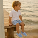 Cotton canvas boat shoes with ties closure.