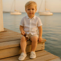 Cotton canvas boat shoes with ties closure.