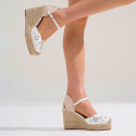 Women's open-back espadrille with wedge and flowers design.