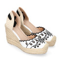 Women's open-back espadrille with wedge and flowers design.