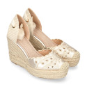 Women's open-back espadrille with wedge and flowers design.