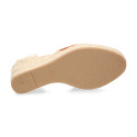 Women's open-back espadrille with wedge and flowers design.