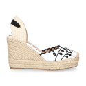 Women's open-back espadrille with wedge and flowers design.