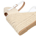 Women's open-back espadrille with wedge and flowers design.