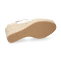 Women's open-back espadrille with wedge and flowers design.