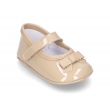 Classic little ballet flat shoes for babies with hook and loop strap and ribbon in patent leather.