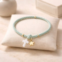 Elastic girl bracelets with cross and golden star.