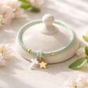 Elastic girl bracelets with cross and golden star.