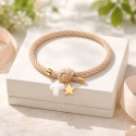 Elastic girl bracelets with cross and golden star.