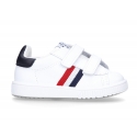 Washable leather tennis shoes laceless and with flag design.