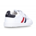 Washable leather tennis shoes laceless and with flag design.