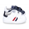 Washable leather tennis shoes laceless and with flag design.