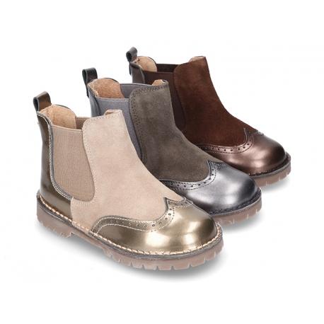 Combined leather kids ankle boots with elastic band and thick outsole.